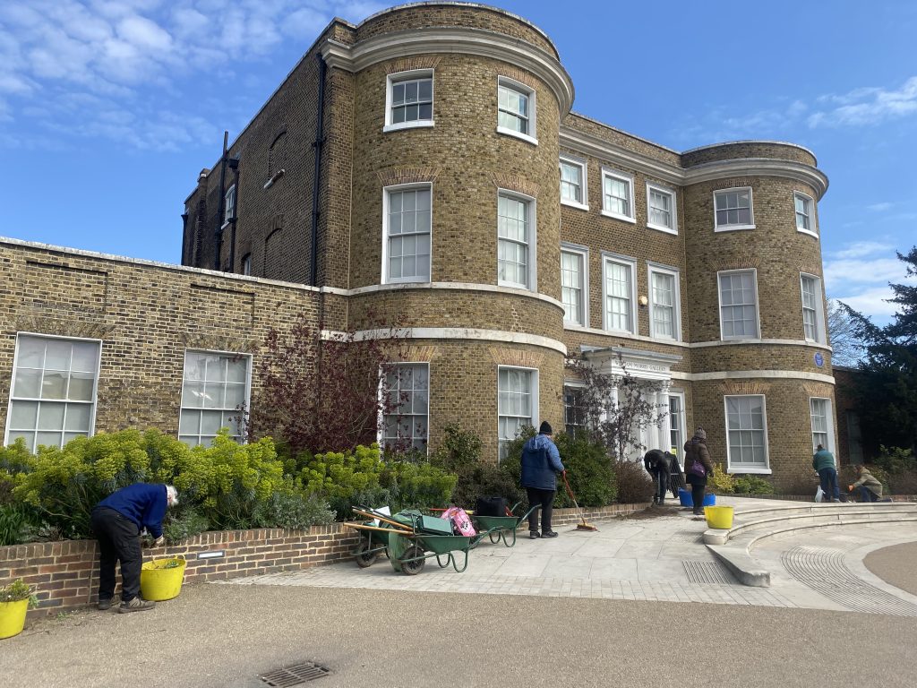 Garden volunteers working on the beds at the front of William Morris Gallery