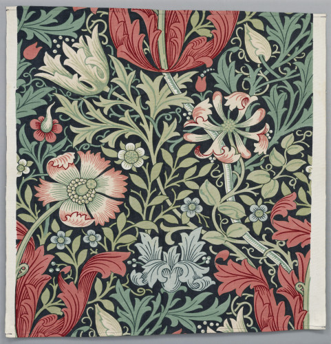 Large scale floral design with red and blue flowers against green foliage