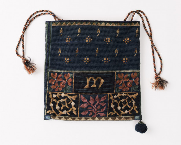blue bag with tassles and embroidery
