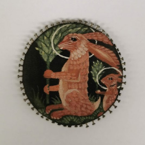 Black silk pincushion with painted rabbits and leaves