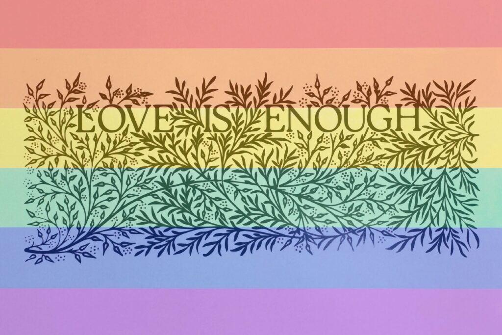 Love is enough is written in black with a rainbow background, with leaves and branches intertwining the words